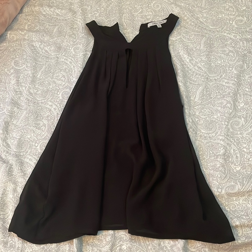 black dressy shirt, button up in the back, and deep v neck in the front